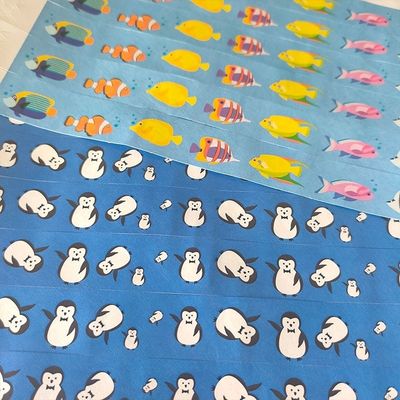 Braccialetti di carta Tyvek per disegni personalizzati Stock di dinosauri Conigli Palloni e altro